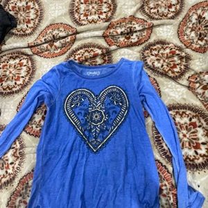 Blue long sleeve shirt the brand is mudd and it is a 12/M